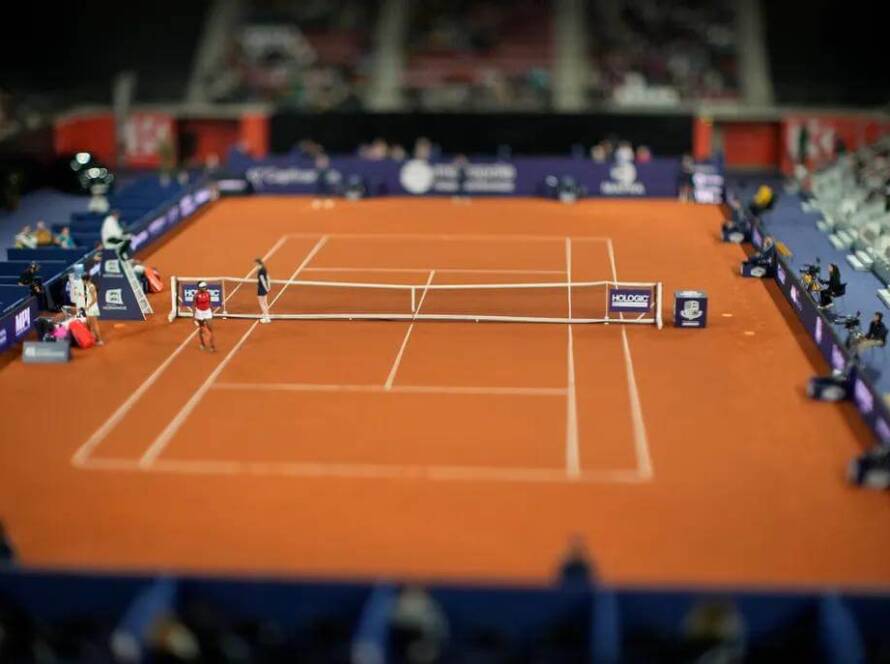 Red clay tennis court from aerial view